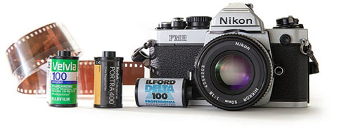 A picture of a photo camera and films for it
